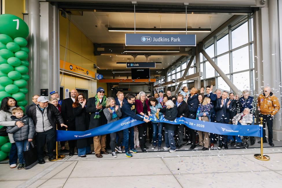 A large group of elected officials and community leaders cut a blue ribbon at Judkins Park Station to mark the official opening of the 2 Line's Crosslake Connection