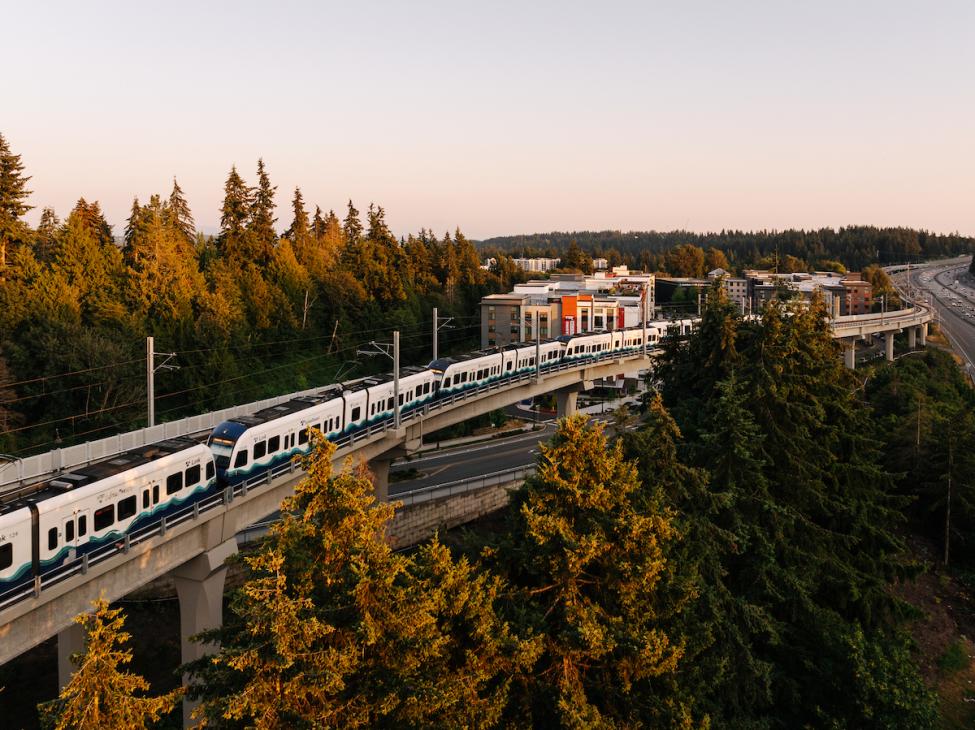 An aerial view of a Link train going south from Mountlake Terrace Station on elevated tracks