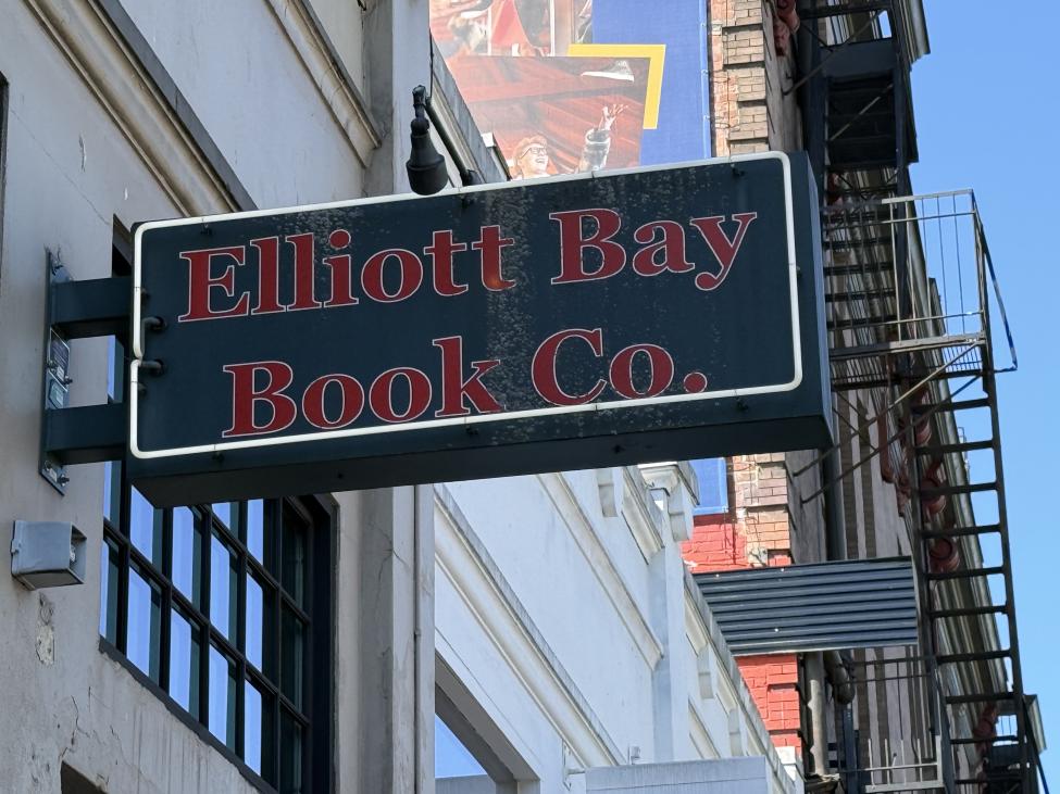 A black sign with red lettering reads "Elliott Bay Book Co."