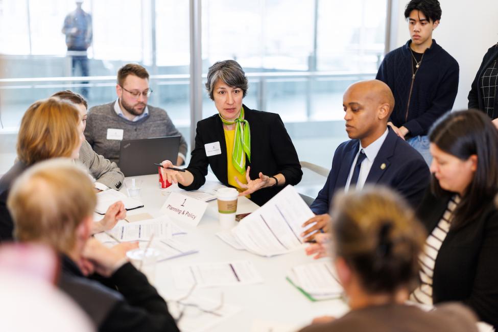 Sound Transit employees and board members sit around a table and discuss the Enterprise Initiative