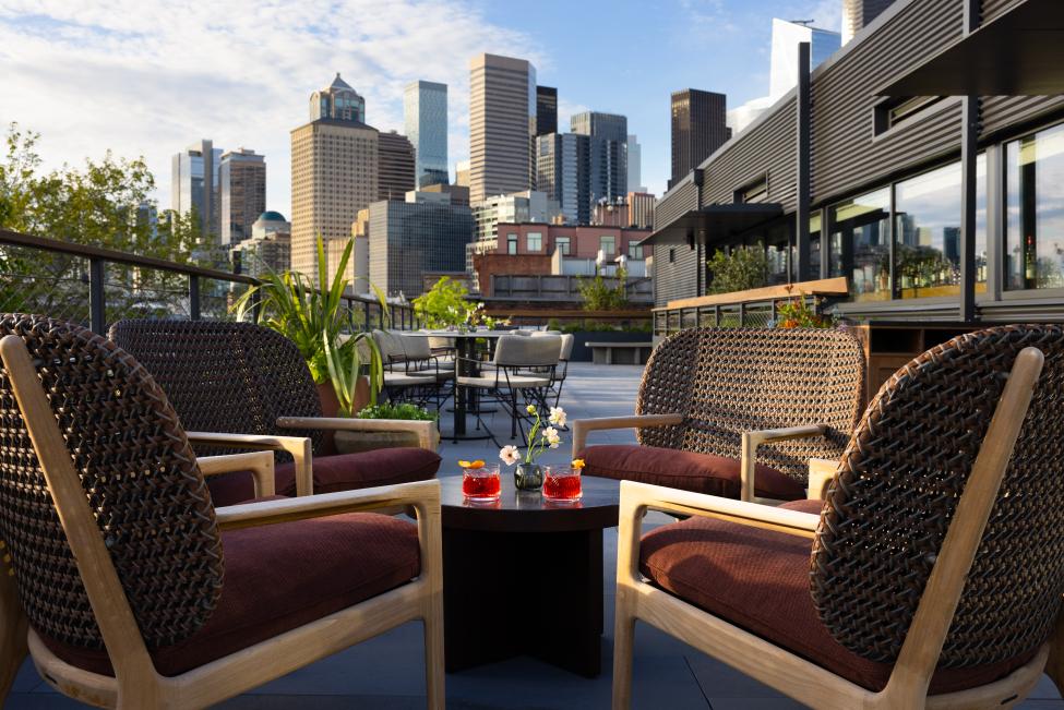 A photo of the rooftop space provided by the Firn with the skyline in the background