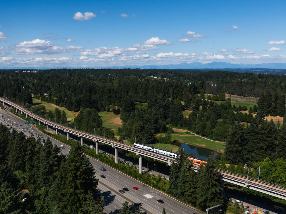A drone shot of a train leaving Pinehurst station