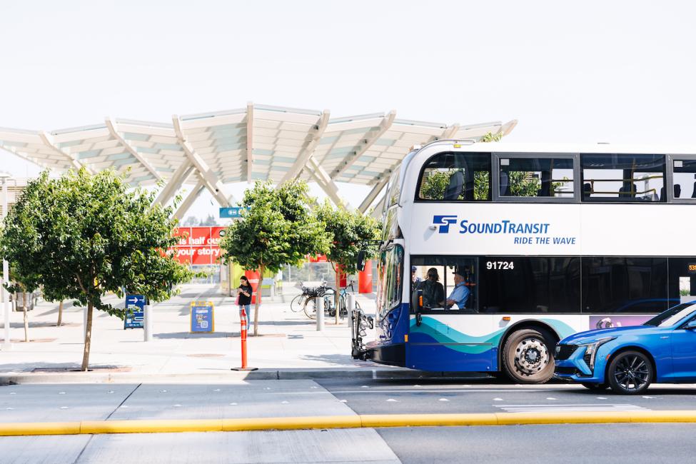 An ST Express bus pulls up outside the Bellevue Transit Center