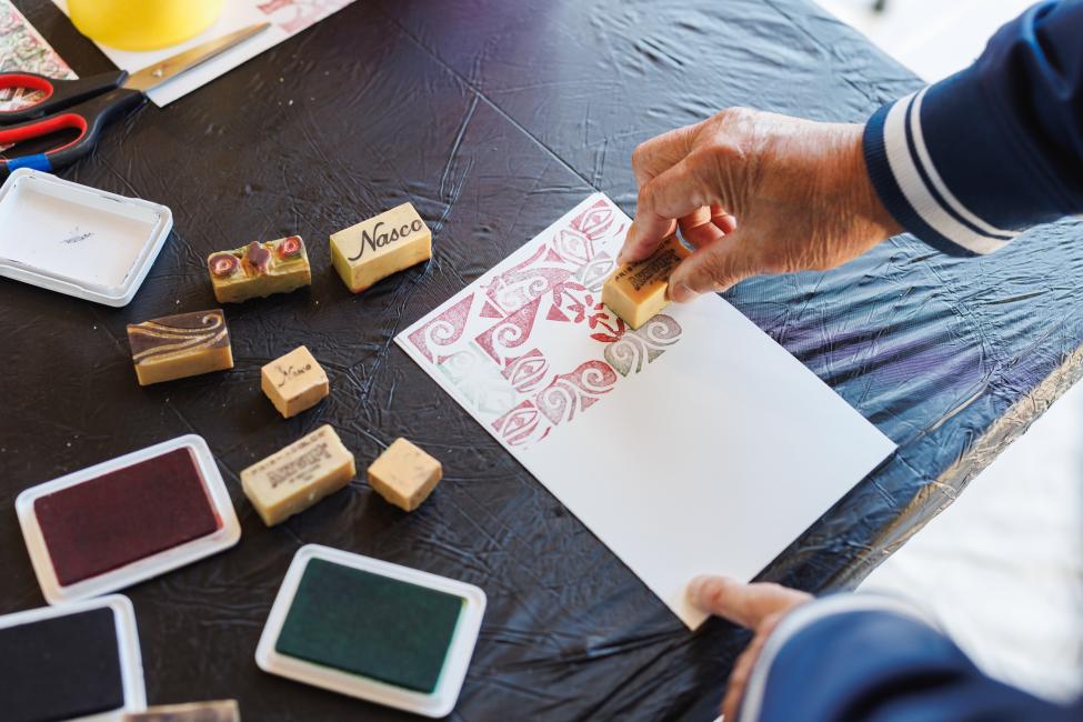 Print making materials and paper on a table