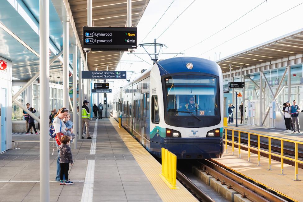 A train pulls into the platform at Pinehurst Station