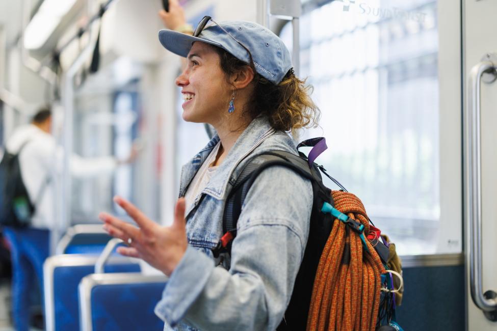 Community engagement team member inside light rail train