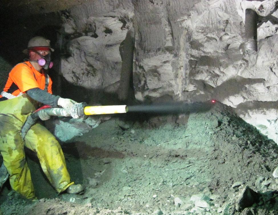 A miner stabilizes a newly excavated portion of the cross passage beneath NE 61st Street at 12th Avenue NE.