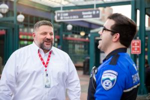 Ken Cummins, Sound Transit Director of Safety and Security jokes with a Security Officer