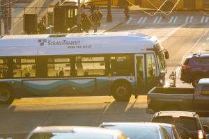A Sound Transit bus travels through downtown Seattle