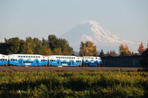A Sounder commuter rail train with Mt. Rainier in the distance