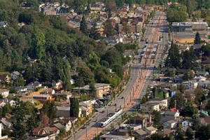 An aerial shot of Link light rail running through Seattle's Rainier Valley.