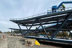 Pedestrian bridge truss segments on eastbound SR 520 shoulder at Northeast 148th Street.