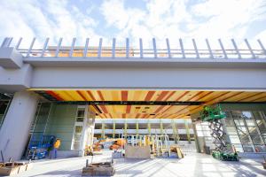 A light rail guideway can be seen with orange and red paneling underneath by South Bellevue Station.