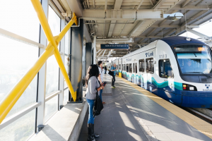 Lynnwood Link project update header, photo of riders waiting to board link light rail