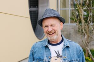 Roosevelt neighborhood activist Jim O'Halloran smiles for a photo at Roosevelt Station