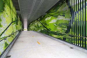 Verdant art by Leo Saul Berk graces the pedestrian bridge at Overlake Village Station.