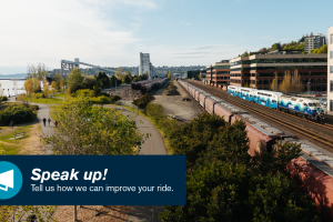 A Sounder commuter rail train heading into Seattle along the waterfront.