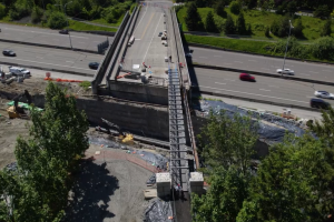 A drone shot of a pedestrian bridge over the NE 60th Street overpass. 