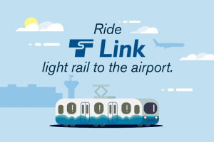 An illustration of a 1 Line train headed to SeaTac International Airport with the Seattle skyline in the background