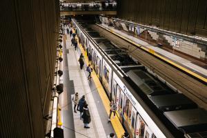 A view from the mezzanine of a Link train pulling into University Street Station