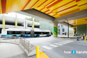 An ST Express bus drives next to the new South Bellevue Link station