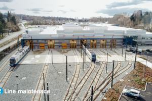 Trains in the yard of the Operations and Maintenance Facility in Bellevue. Text reads '2 Line maintenance'