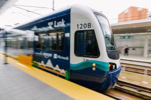 A train wrapped in a commemorative 2 Line ad at Bellevue Downtown Station