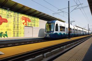 Temporary art is seen on the walls of a Link station under construction