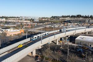 A one-car Link train on the elevated alignment for Link light rail in Federal Way.