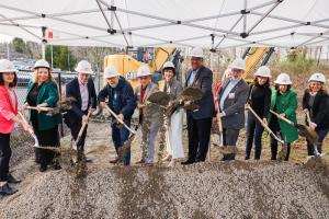 Speakers and other VIPs break ground at the groundbreaking ceremony for the Spring District Station transit-oriented development (TOD), hosted by BRIDGE Housing on February 27, 2025.