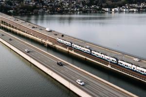 A four-car Link train travels across the I-90 floating bridge