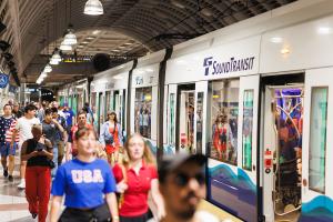 Soccer fans exit a Link train at Pioneer Square Station during the World Cup in Seattle