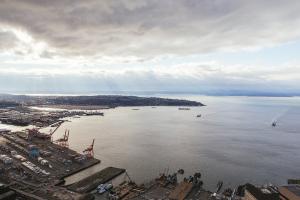 A view of Elliott Bay and West Seattle from a tall building in downtown Seattle