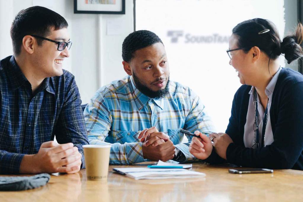 Sound Transit staff around a table talking