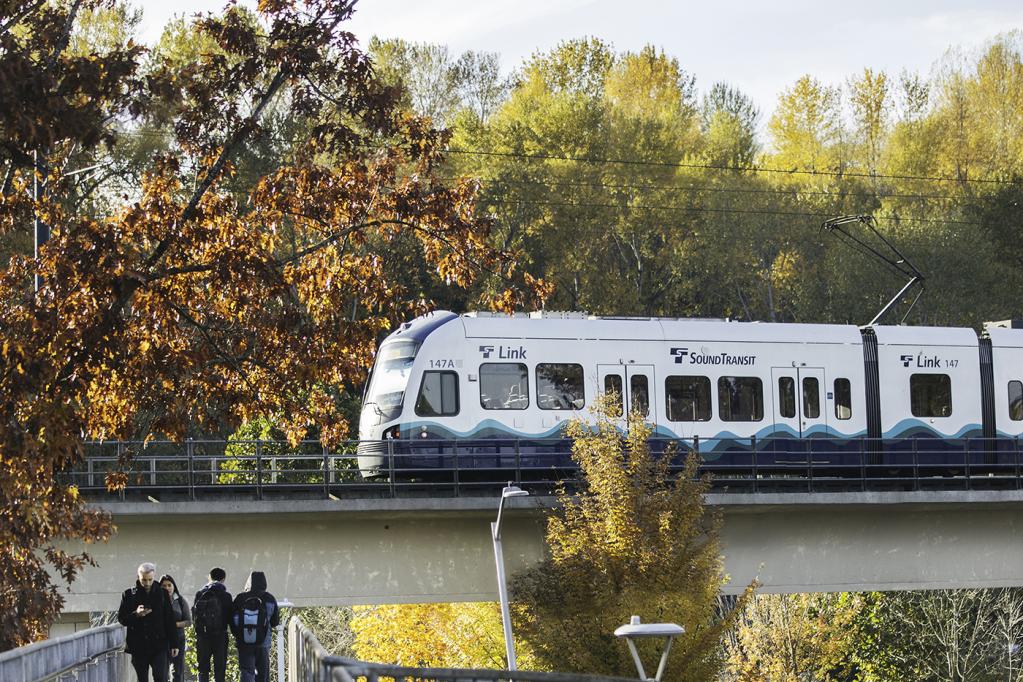Photo of people walking on a pedestrian bridge next to Mount Baker Link Light Rail Station, West Seattle and Ballard Link Extensions