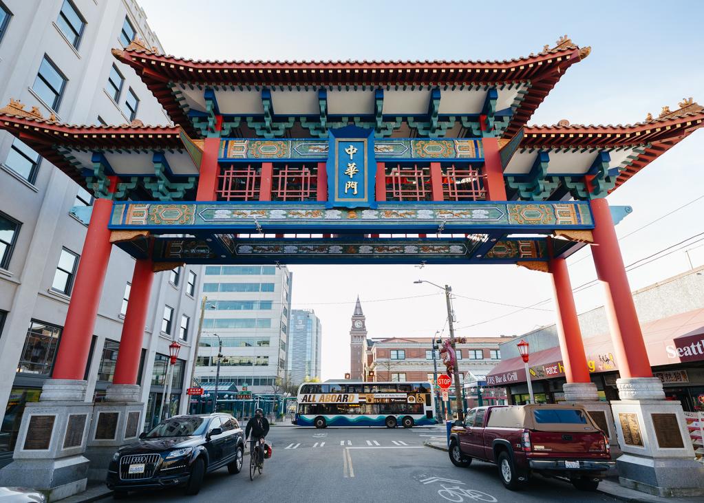 A Sound Transit Express bus passes in front of the Historic Chinatown Gate in the Chinatown-International District neighborhood in Seattle.