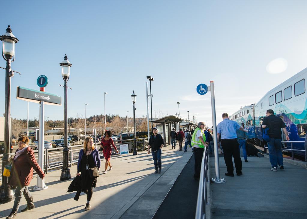 People walk along the platform at the Edmonds Sounder Station.