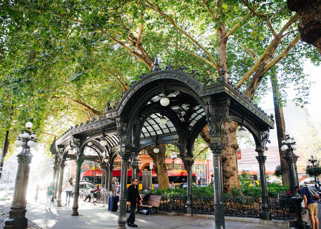 People walk through Pioneer Square in downtown Seattle