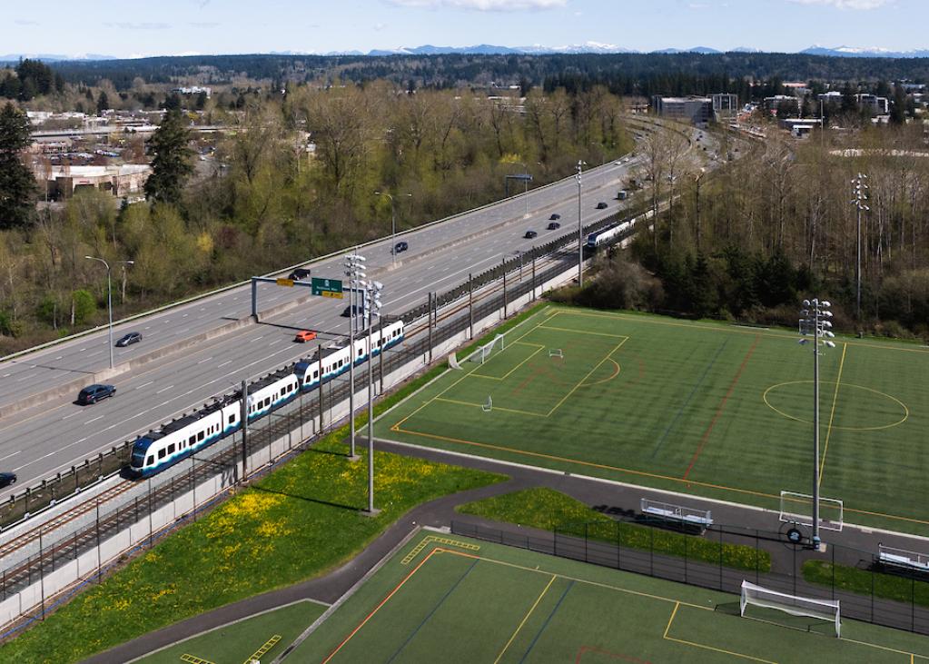 A two-car Link train on the tracks by Marymoor Park in Redmond