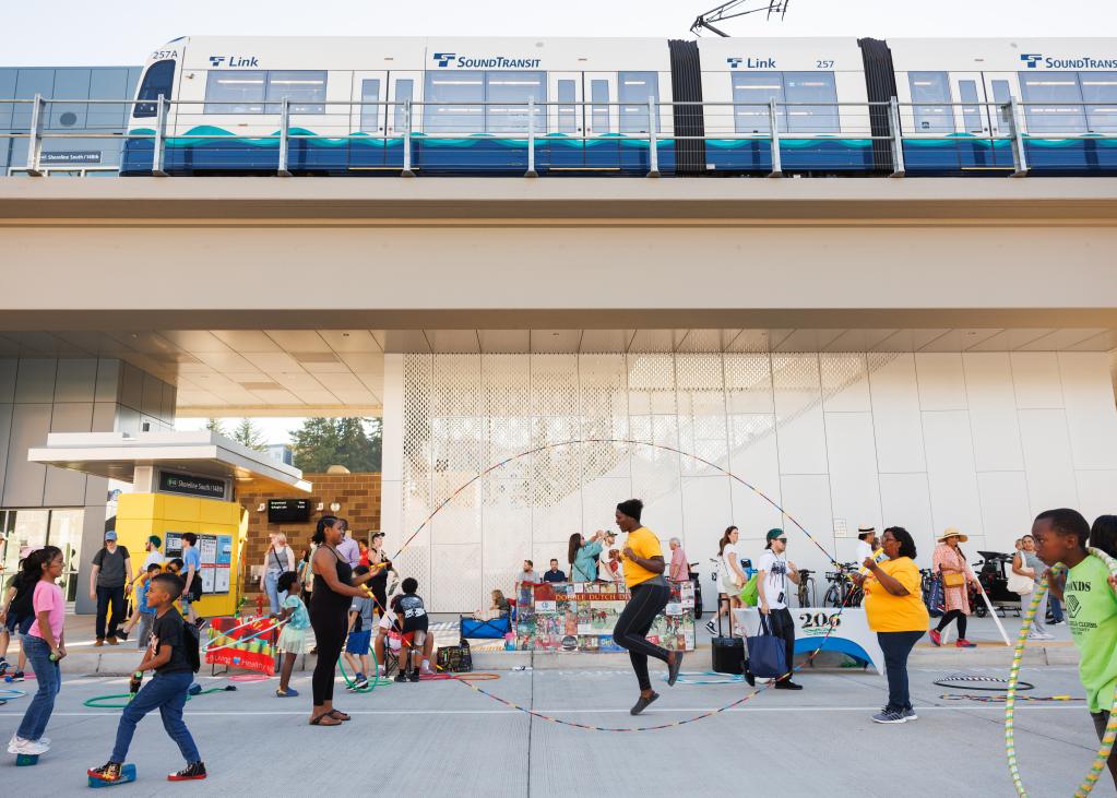People gather and jump rope at the Lynnwood Link Extension opening celebration.