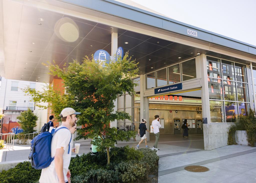 A view of the southern entrance to the Roosevelt station while a person walks by