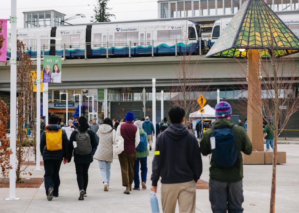 People walk around the plaza at Federal Way Downtown Station