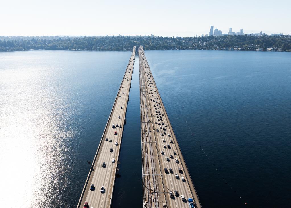 An overhead photo of the bridge across Lake Washington with both the highway and Link track in view.