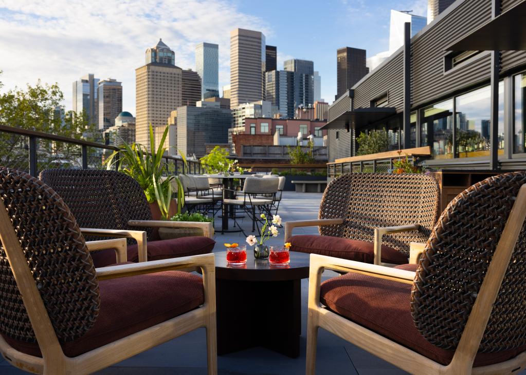 A photo of the rooftop space provided by the Firn with the skyline in the background