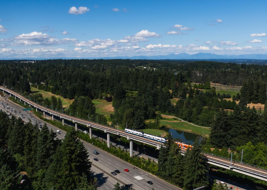 A drone shot of a train leaving Pinehurst station