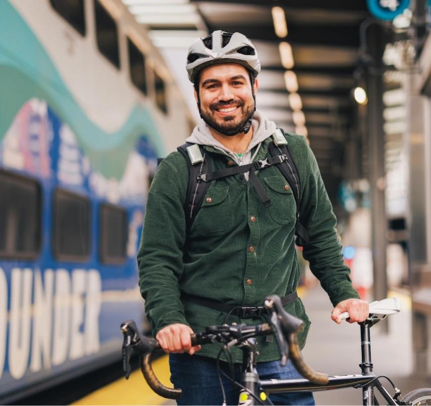 A passenger with a bike at a Sounder station.