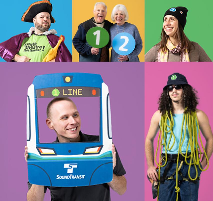 Community members hold up Link light rail swag as they pose for portraits.