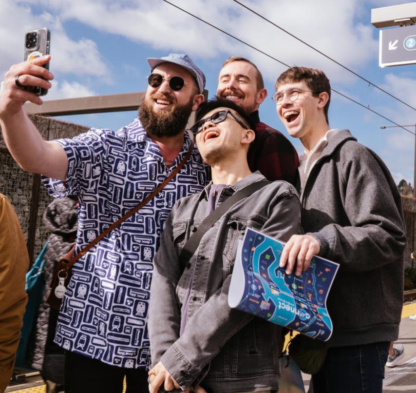A group of jovial riders pose for a selfie