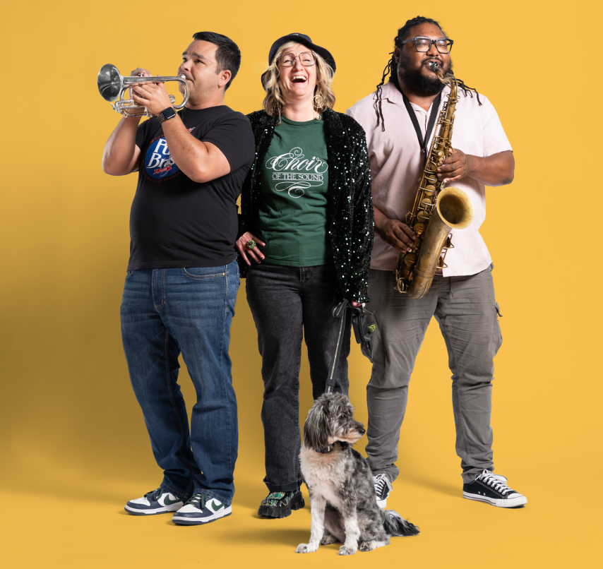 A group of people playing instruments in a celebratory manner.