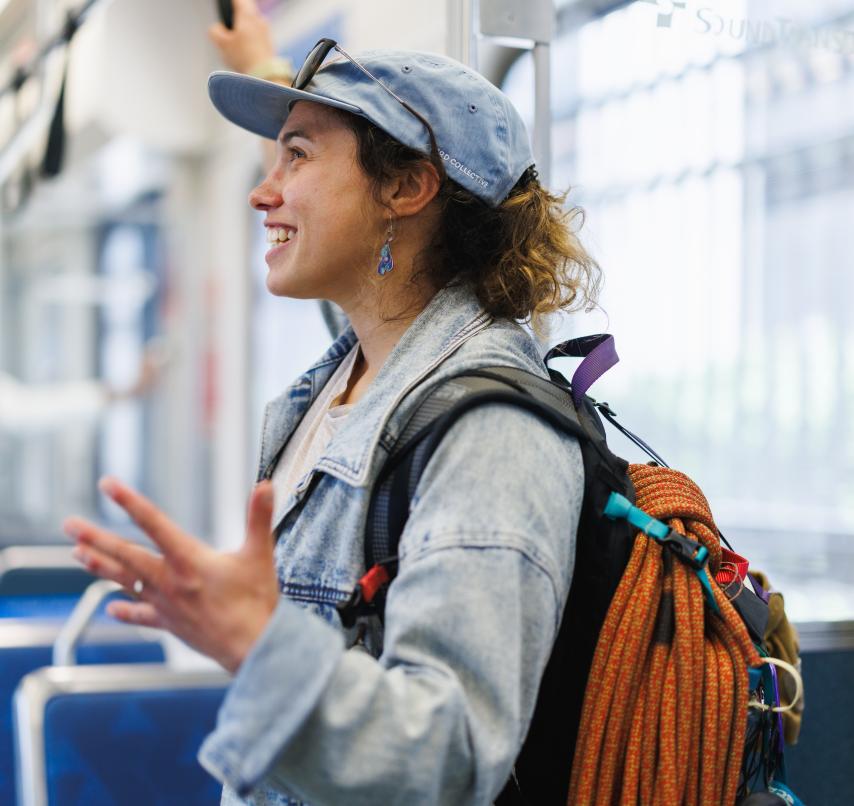 Community engagement team member inside light rail train
